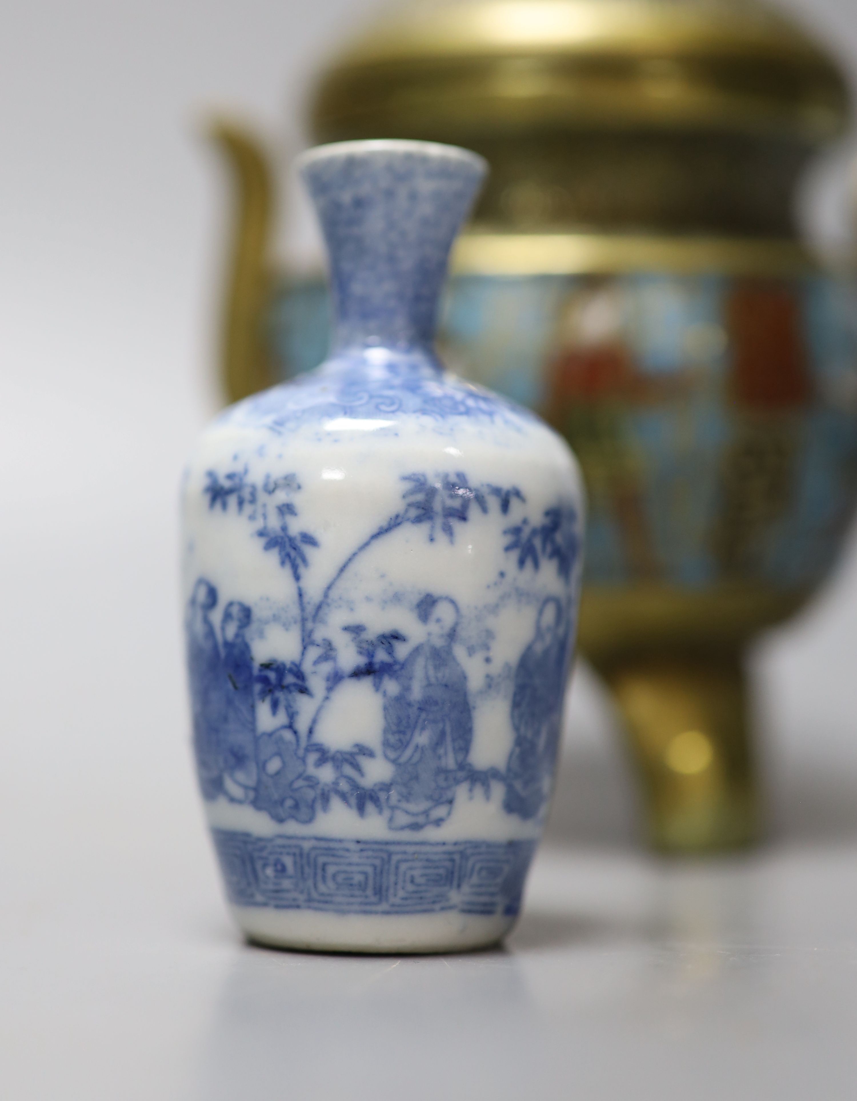 A group of Chinese porcelain, 19th /20th century, to include a pair of yellow ground bowls, 10.8 cm diameter, a blue and white vase, Xuande mark, a similar bowl and vase, and a champleve enamel bronze koro and cover